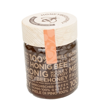 Greek Raw Pine Honey Drizzled from Wooden Spoon Close-up of Greek Raw Pine Honey Drizzling from Wooden Spoon