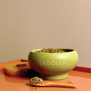 Sea Salt & Oregano in Handmade Ceramic Bowl on Kitchen Counter. Premium sea salt and Mediterranean oregano on kitchen counter with ceramic bowl.