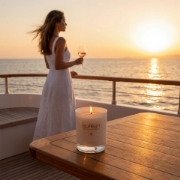 Aurean scented candle on yacht table at sunset, luxury lifestyle Greek ambiance with sea view